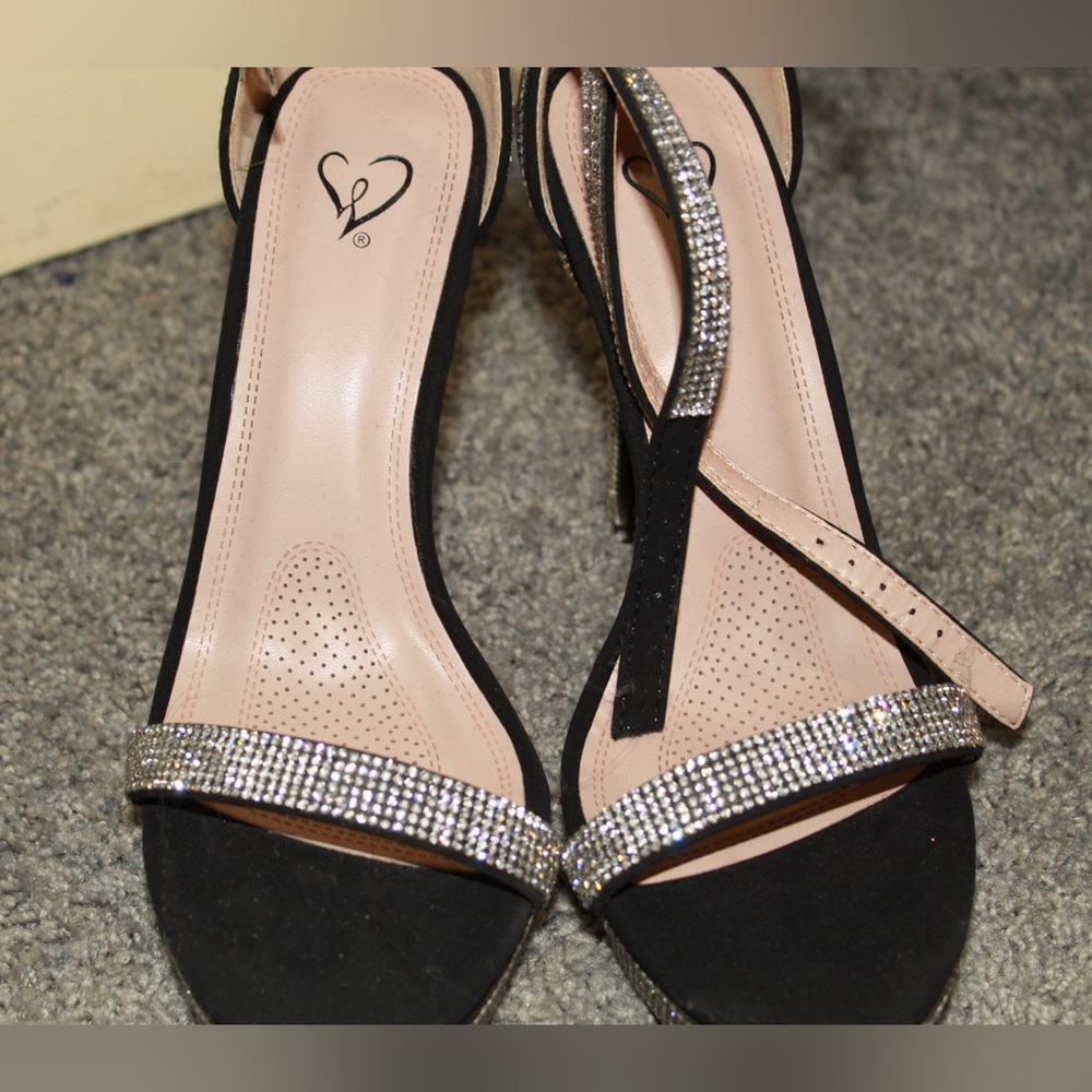 Windsor heels. Black with rhinestones. Never worn still with tag.